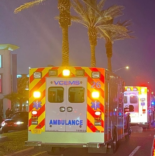 Senior Home Watch & Emergency Assist Services – Fast, trusted care for the home when it matters the most. Ambulance vehicles respond to a nighttime emergency with lights flashing, symbolizing urgent home protection needs